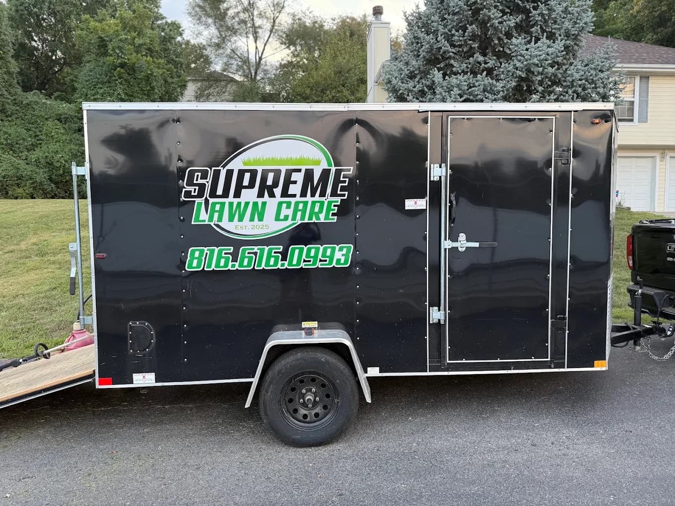 Supreme service trailer parked at a Kansas City home