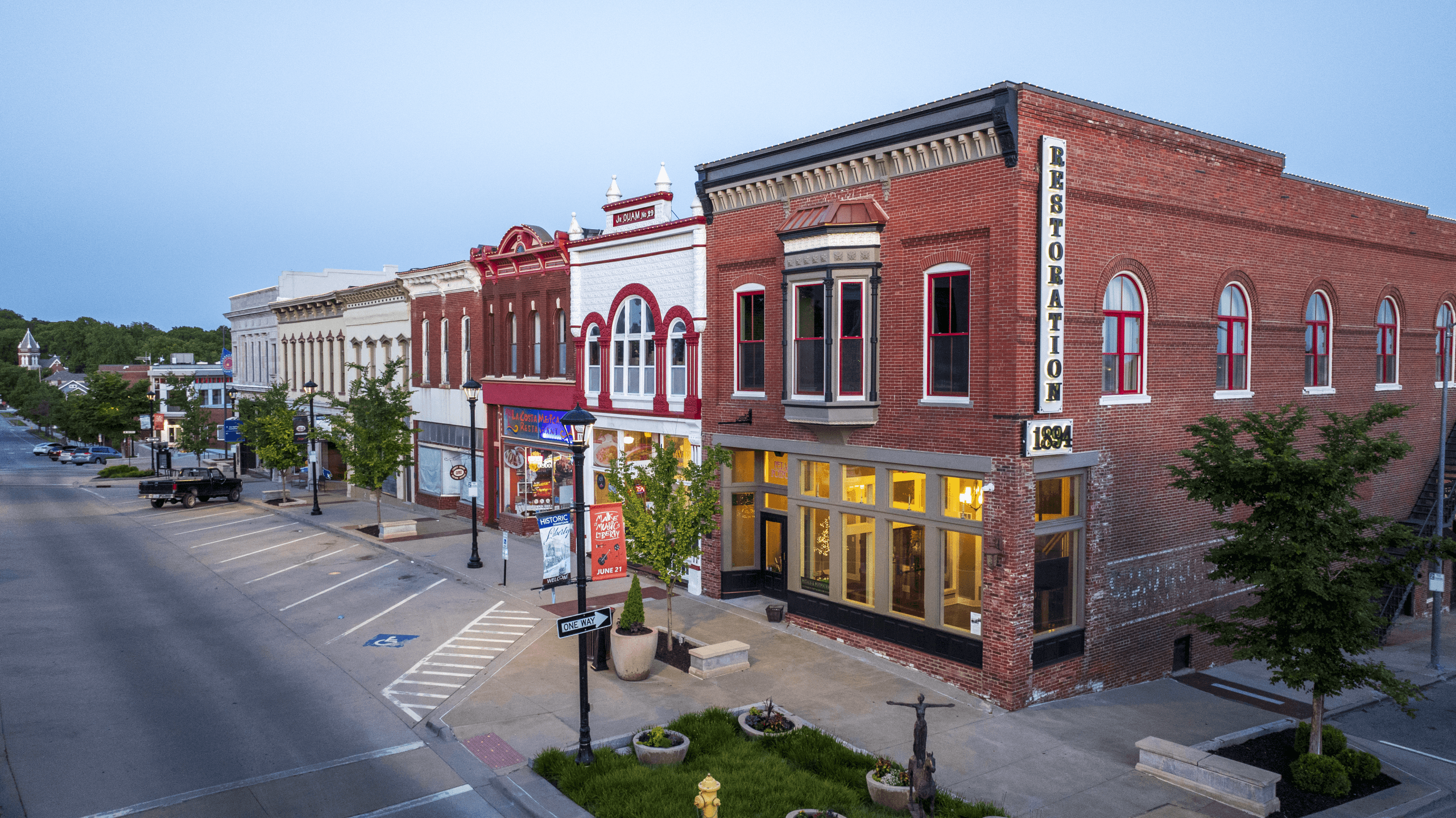 Historic downtown Liberty storefronts and the restored Gano Chapel