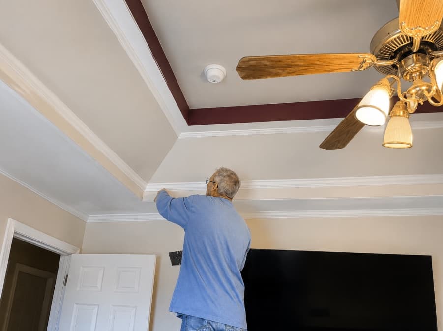 Ken fitting crown molding in a Kansas City home