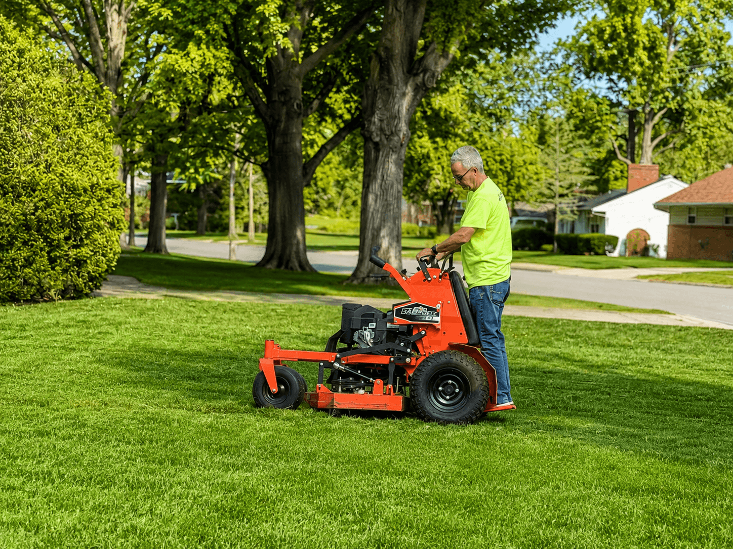 Supreme Lawn Care mower at work on a green residential lawn